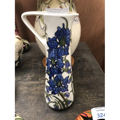 325 - A MOORCROFT POTTERY JUG DECORATED IN THE 'DELPHINIUM' PATTERN DESIGNED BY KERRY GOODWIN, HEIGHT 24CM... 