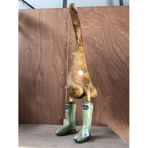 208 - A DECORATIVE WOODEN MODEL OF A DUCK WEARING 'LE CHAMEAU', 1927 WELLINGTON BOOTS