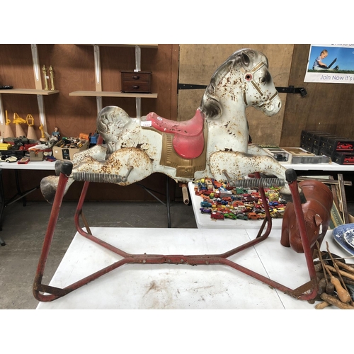 1163 - A VINTAGE METAL FAIRGROUND MODEL OF A HORSE ON RED STAND