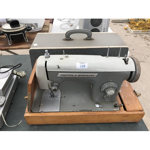 125 - A VINTAGE FRISTER AND ROSSMANN CASED SEWING MACHINE