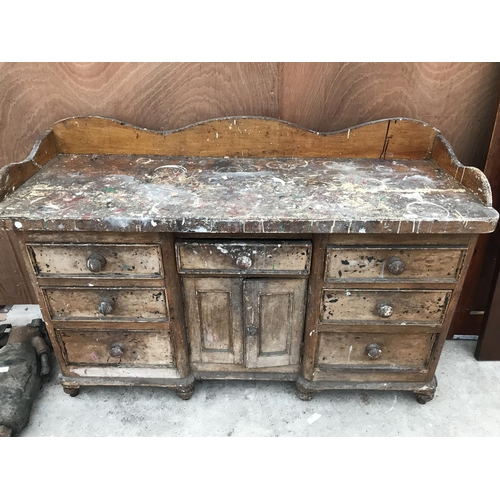 54 - A VINTAGE PINE SIDEBOARD WITH TWO DOORS AND SEVEN DRAWERS