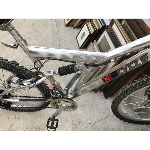 124 - AN X CYCLE MOUNTAIN BIKE WITH 24 SPEED SHIMANO GEAR SYSTEM