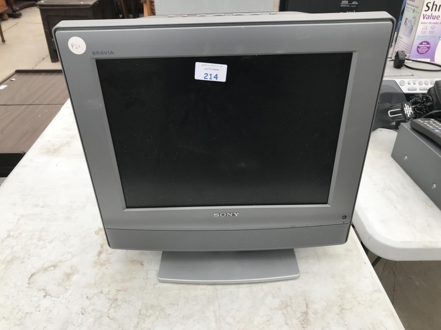 A SONY BRAVIA 15 INCH TV W/O NO LEAD REMOTE