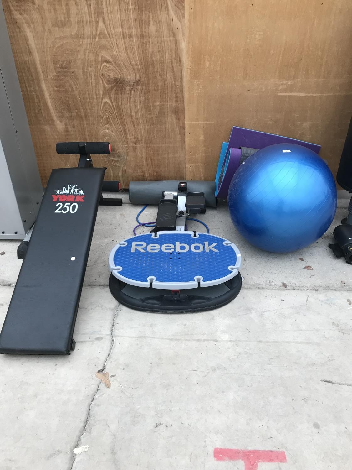 A YORK 250 SIT UP BENCH EXERCISE MATS AN EXERCISE BALL REEBOK