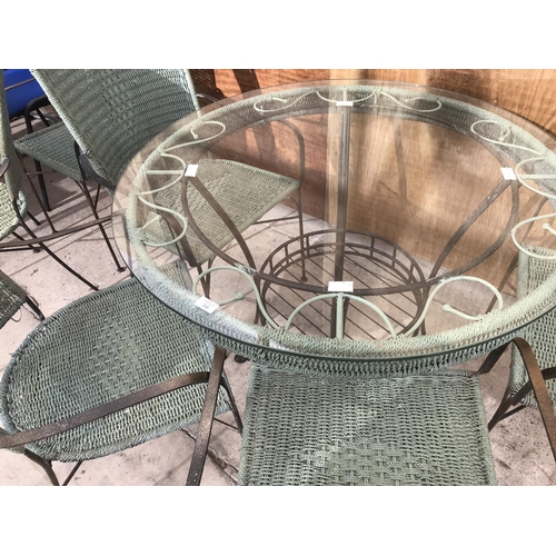 56 - A ROUND GARDEN TABLE WITH GLASS TOP 100CM DIAMETER AND SIX MATCHING CHAIRS