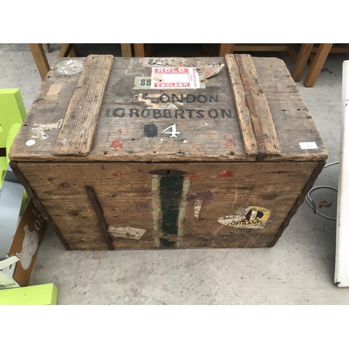 93 - A VINTAGE WOODEN CHEST WITH METAL HANDLES, METAL LINED WITH VARIOUS STICKERS