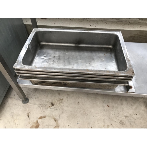 136 - A STAINLESS STEEL SERVING TABLE WITH TRAYS 170CM X 65CM X 100CM AND AN EXTRA STAINLESS STEEL SHELF