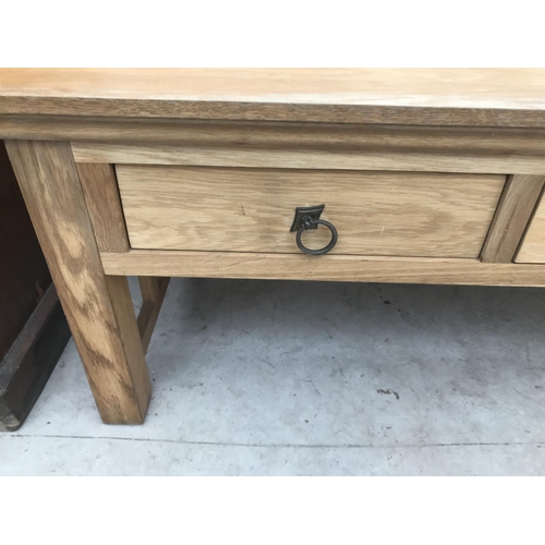 845 - AN OAK COFFEE TABLE WITH TWO DRAWERS