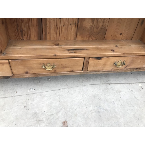 846 - A PINE PLATE RACK WITH TWO DOORS AND FOUR DRAWERS