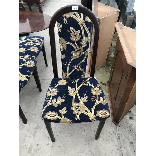 872 - SIX MAHOGANY AND FLORAL PATTERNED DINING CHAIRS