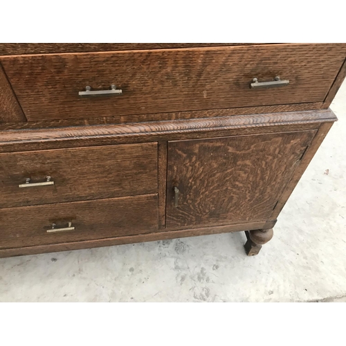 919 - AN OAK SIDEBOARD WITH TWO DOORS AND FOUR DRAWERS