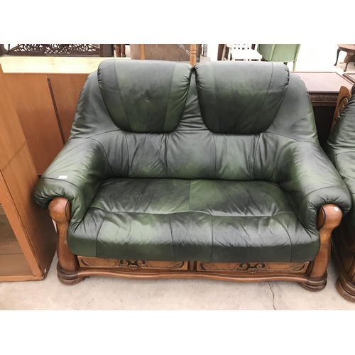 939 - TWO OAK AND GREEN LEATHER TWO SEATER SOFAS