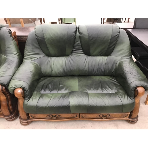 939 - TWO OAK AND GREEN LEATHER TWO SEATER SOFAS