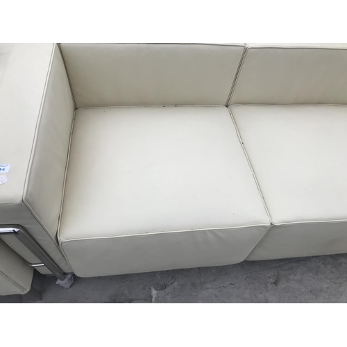 944 - A MODERN 'LE CORBUSIER' CREAM ITALIAN LEATHER THREE SEATER SOFA ON TUBULAR CHROME SUPPORTS 210 CM X ... 