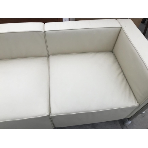 944 - A MODERN 'LE CORBUSIER' CREAM ITALIAN LEATHER THREE SEATER SOFA ON TUBULAR CHROME SUPPORTS 210 CM X ... 