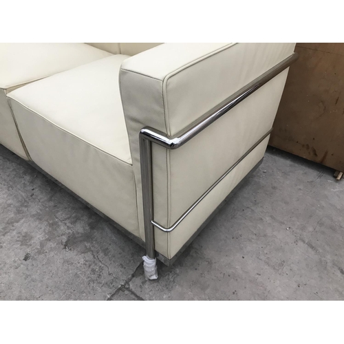 944 - A MODERN 'LE CORBUSIER' CREAM ITALIAN LEATHER THREE SEATER SOFA ON TUBULAR CHROME SUPPORTS 210 CM X ... 