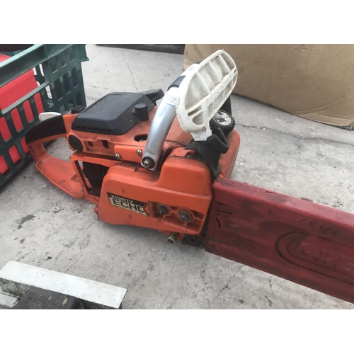 33 - A KIORITZ ECHO PETROL CHAIN SAW WITH TWO PETROL CANS IN WORKING ORDER