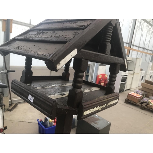 34 - A ORNATE WOODEN  BIRD TABLE APPROX SIX FEET HIGH