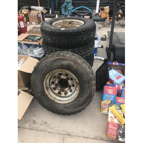 54 - FIVE WHEELS AND TYRES (FOUR 235/75/R15 AND ONE 215 R15)