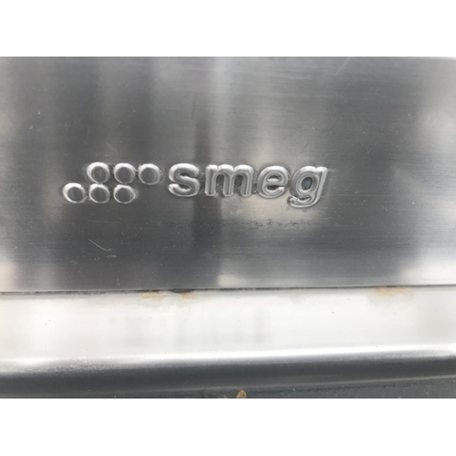 142 - A SMEG RANGE COOKER WITH A FIVE RING GAS HOB, TWO ELECTRIC OVENS AND GRILL