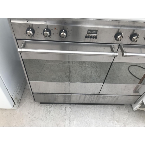 142 - A SMEG RANGE COOKER WITH A FIVE RING GAS HOB, TWO ELECTRIC OVENS AND GRILL