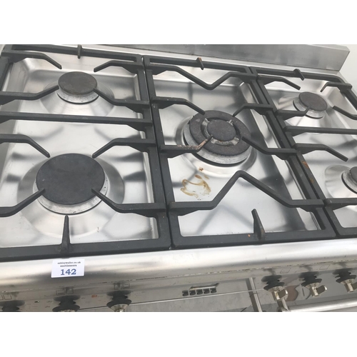 142 - A SMEG RANGE COOKER WITH A FIVE RING GAS HOB, TWO ELECTRIC OVENS AND GRILL