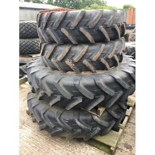 69 - A SET OF FOUR WHEELS AND TYRES - TWO 12 4 24 AND TWO 13 6 38