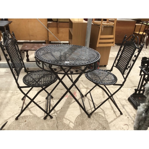 222 - AN ORNATE BISTRO STYLE TABLE WITH TWO MATCHING CHAIRS