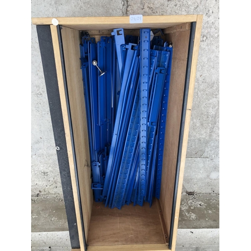 1090 - A WOODEN BOX CONTAINING BLUE METAL SHOP RACK FITTINGS