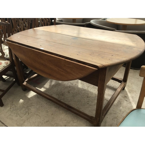 1172 - A CIRCULAR FRENCH OAK DROP LEAF DINING TABLE TOGETHER WITH MATCHING SEVEN DINING CHAIRS