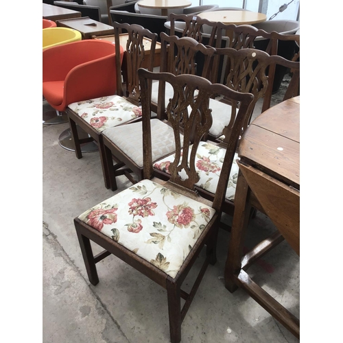 1172 - A CIRCULAR FRENCH OAK DROP LEAF DINING TABLE TOGETHER WITH MATCHING SEVEN DINING CHAIRS