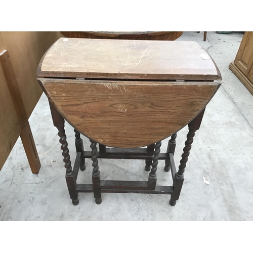 1183 - AN OAK DROP LEAF TABLE