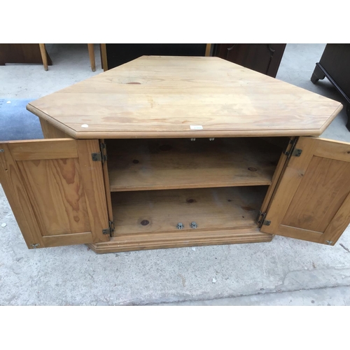 1205 - A PINE TV UNIT WITH TWO DOORS