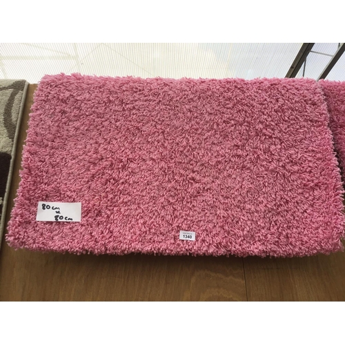 1340 - AN AS NEW 80CM X 80CM PINK PILE RUG