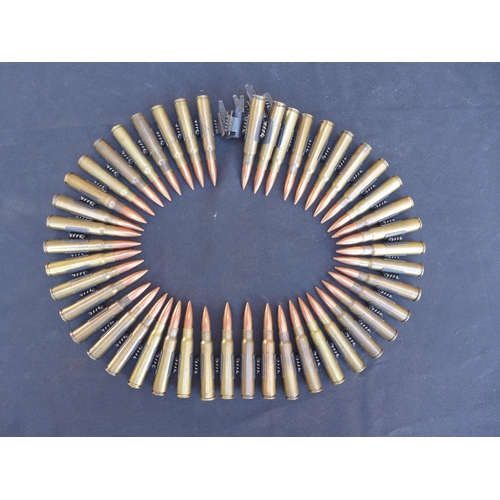 327 - A STRIP OF INERT 303 AMMUNITION