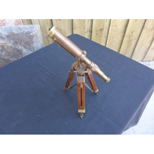 328 - A BRASS TELESCOPE ON WOODEN TRIPOD STAND