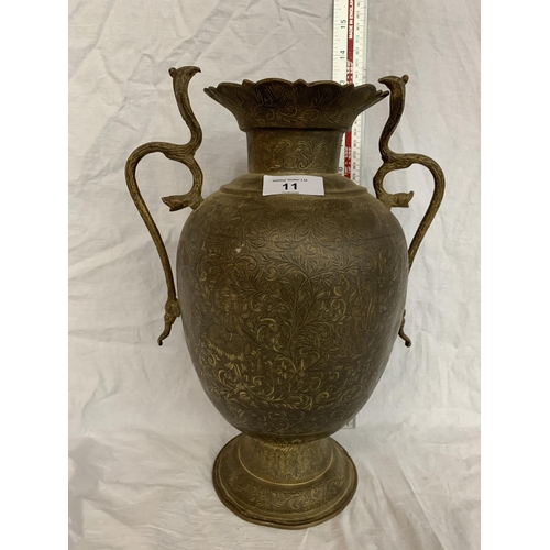 11 - A TALL BRASS VASE WITH COBRA STYLE HANDLES