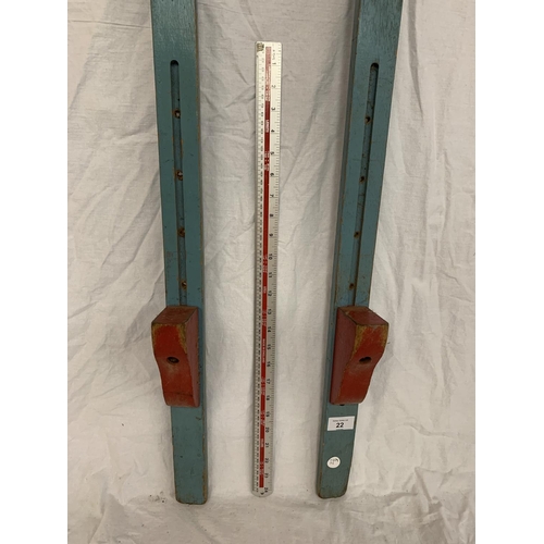 22 - A VINTAGE PAIR OF WOODEN STILTS