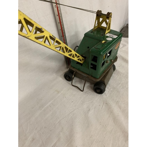 83 - A VINTAGE TIN PLATE TOY CRANE