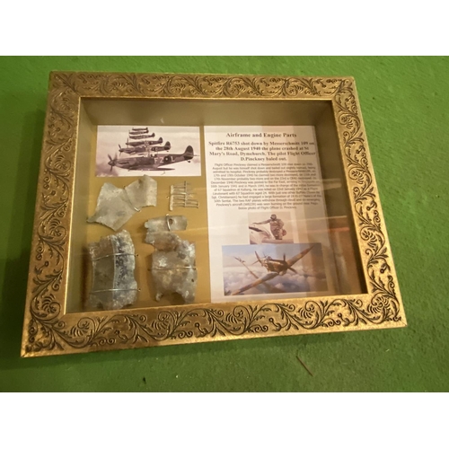 435 - A FRAMED MONTAGE OF RELIC SPITFIRE PARTS