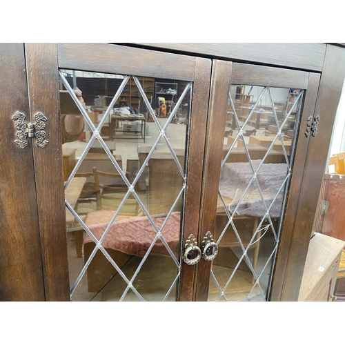 1505 - A PRIORY STYLE FLAT FRONT OAK CORNER CUPBOARD WITH TWO LOWER DOORS AND TWO UPPER LEAD GLAZED DOORS