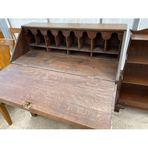 1510 - A GEORGIAN OAK BUREAU ON BRACKET FEET WITH FALL FRONT WITH FOUR DRAWERS HAVING BRASS HANDLES AND ESC... 