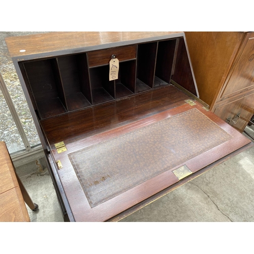 1534 - A MAHOGANY BUREAU ON CABRIOLE SUPPORTS WITH FALL FRONT AND THREE DRAWERS