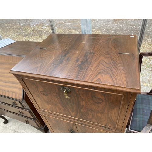 1535 - A WALNUT COCKTAIL CABINET WITH FALL FRONT AND SIMULTANEOUS RAISING TOP, TWO LOWER DOORS AND MIRRORED... 