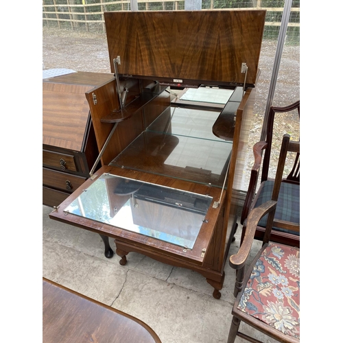 1535 - A WALNUT COCKTAIL CABINET WITH FALL FRONT AND SIMULTANEOUS RAISING TOP, TWO LOWER DOORS AND MIRRORED... 