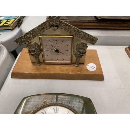 125 - TWO CLOCKS TO INCLUDE A EUROPA ON A WOODEN BASE, AN ONYX EXAMPLE, A BAROMETER AND A MINATURE SUNDIAL