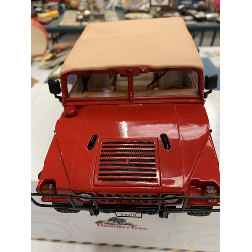 128 - A BOXED THUNDER TRACK RED JEEP STYLE CAR