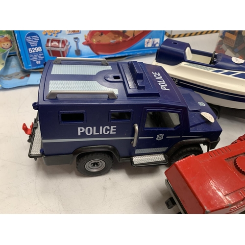 129 - A SPEED BOAT, A COMBINE HARVESTER, A POLICE VAN AND TWO PLAYMOBIL KITS OF A PIRATE SHIP AND TRACTOR ... 