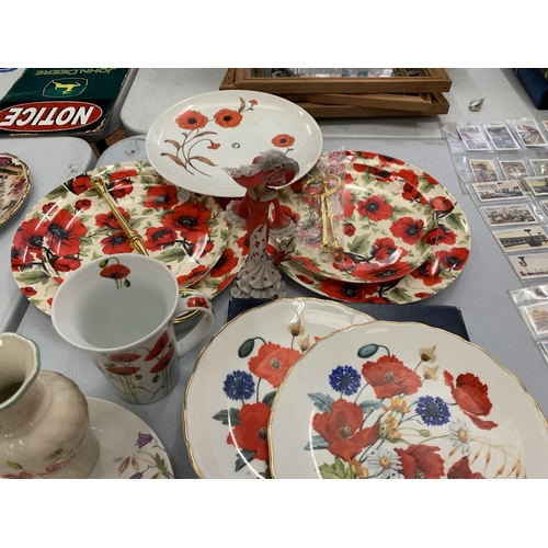 146 - A LARGE COLLECTION OF POPPY THEMED CERAMICS TO INCLUDE PLATES, VASE, LADY FIGURINE ETC