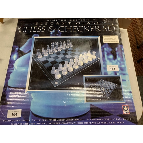 162 - A NEW AND BOXED LIMITED EDITION ELEGANT GLASS CHESS AND CHECKER SET